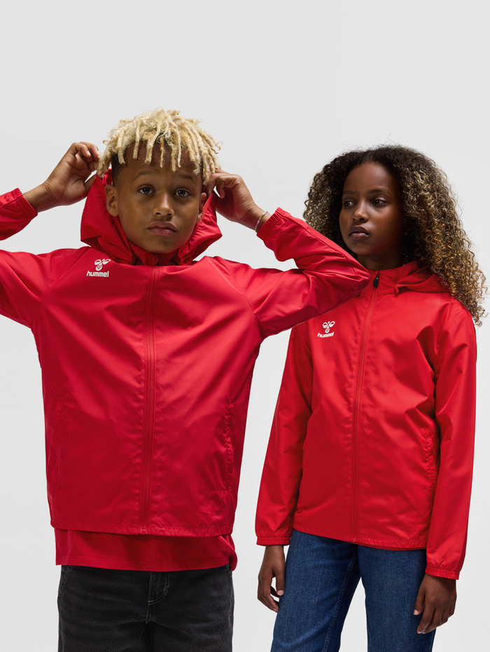 hmlESSENTIAL AW JACKET KIDS, TRUE RED, model