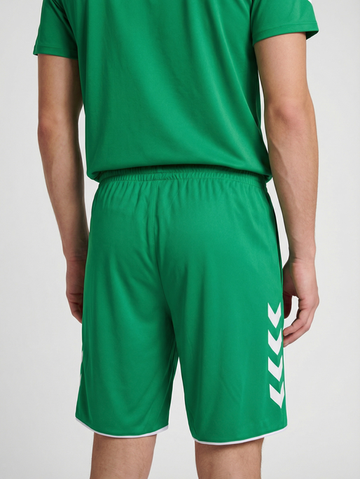 hmlCORE 2.0 SHORTS, JELLY BEAN/WHITE, model