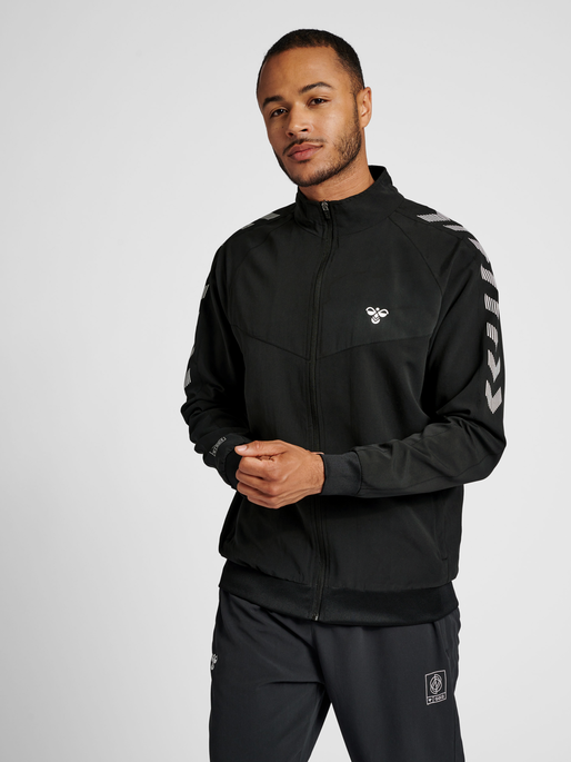 hmlGG12 TRACK JACKET, BLACK, model